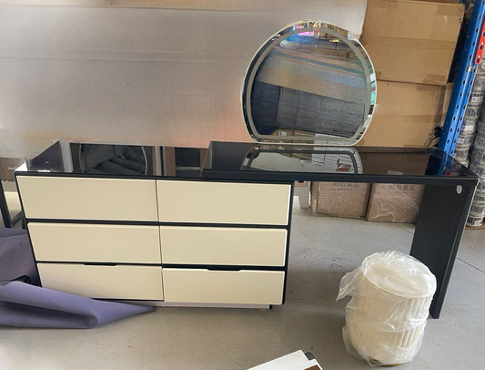 Black and white vanity set with mirror and ottoman