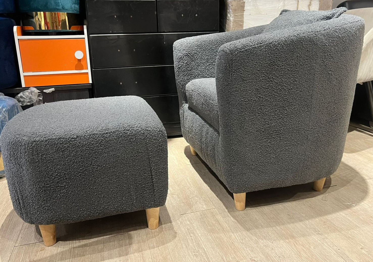 Grey boucle tub chair and ottoman