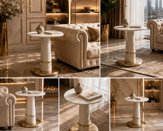 A round white marble-top side table with a cylindrical pedestal base and a brushed gold circular foot ring