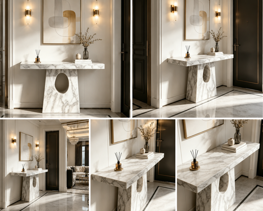 A modern console table with a white and gray marble top and sculptural stone base.